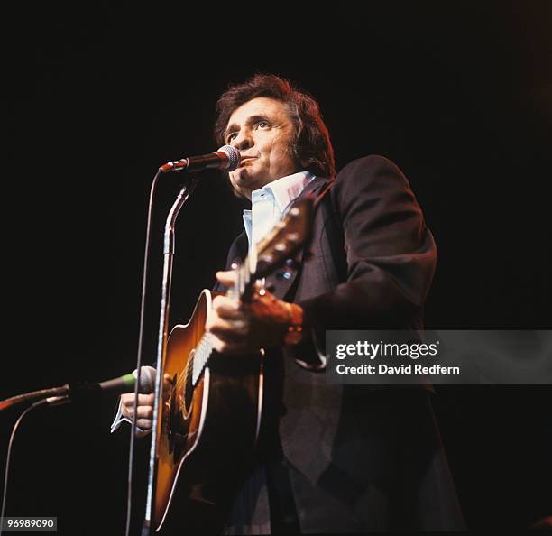 American singer Johnny Cash performs on stage at Wembley Arena, London in March 1979.