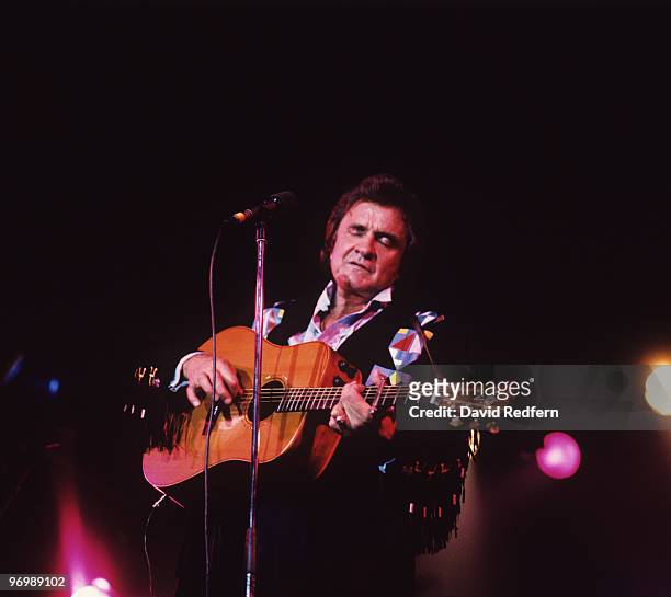 American singer Johnny Cash performs on stage at the Country Music Festival held in Peterborough, England on August 30, 1987.