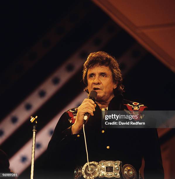 American singer Johnny Cash performs on stage at the Country Music Festival held at Wembley Arena, London on March 31, 1986.