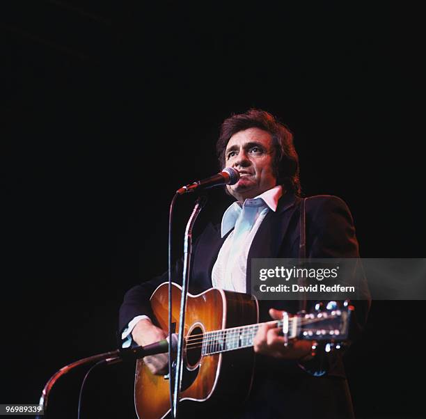 American singer Johnny Cash performs on stage at Wembley Arena, London in March 1979.