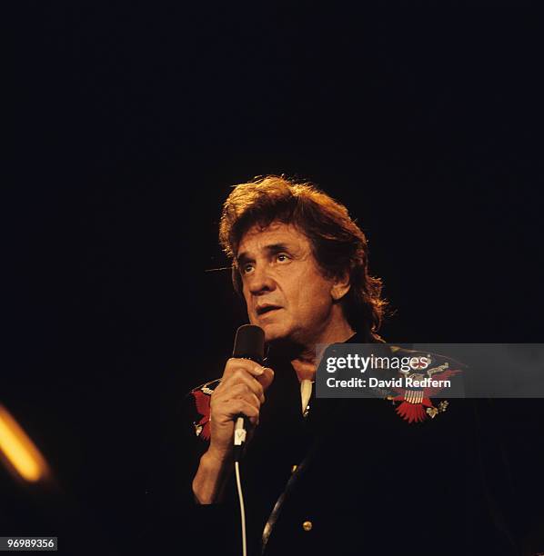 American singer Johnny Cash performs on stage at the Country Music Festival held at Wembley Arena, London on March 31, 1986.