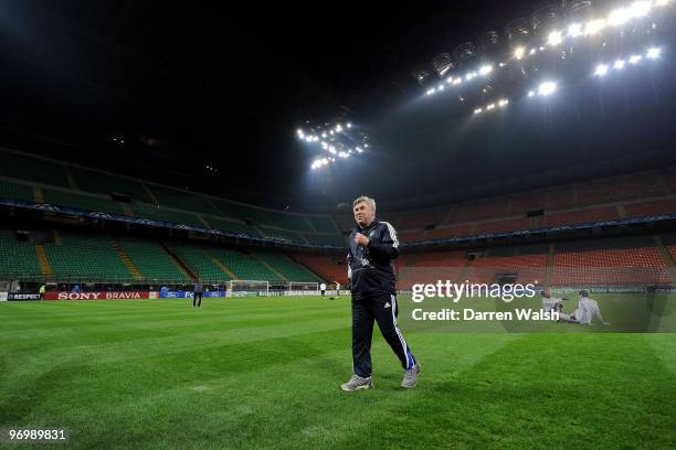 Chelsea Manager Carlo Ancelotti walks across the pitch during a training session on the day before the UEFA Champions League match between Inter...