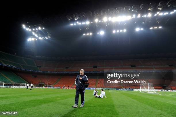 Chelsea Manager Carlo Ancelotti walks across the pitch during a training session on the day before the UEFA Champions League match between Inter...