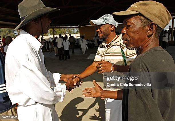 Haitian Voodoo Houngan, or priest, Jul Miste arrives for a ceremony for earthquake victims in the Ti Ayiti neighborhood February 23, 2010 in Cité...