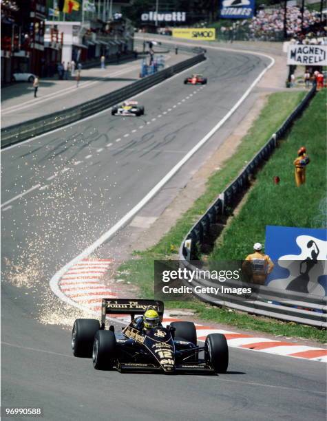 Sparks fly as Ayrton Senna from Brazil drives the John Player Special Team Lotus-Renault 98T into Eau Rouge during the Belgian Grand Prix on 25th May...