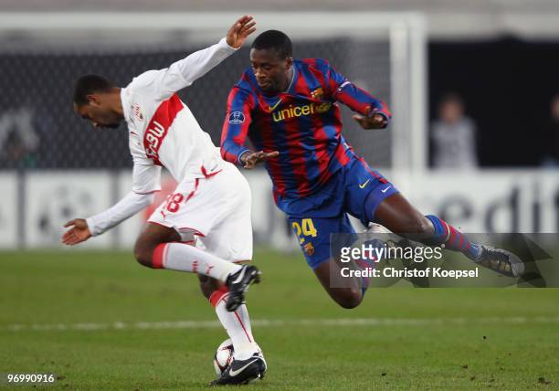 Cacau of Stuttgart battles for the ball with Yaya Toure of Barcelona during the UEFA Champions League round of sixteen, first leg match between VfB...