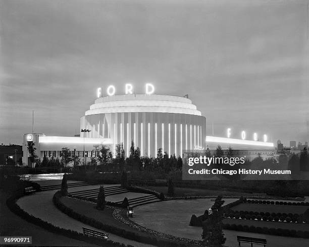 Exterior view of the Ford Motor Building , illuminated at dusk, at the Century of Progress International Exposition , Chicago, Illinois, 1933.