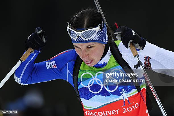 Italy's Michela Ponza competes in the women's Biathlon 4x6 km relay at the Whistler Olympic Park during the Vancouver Winter Olympics on February 23,...