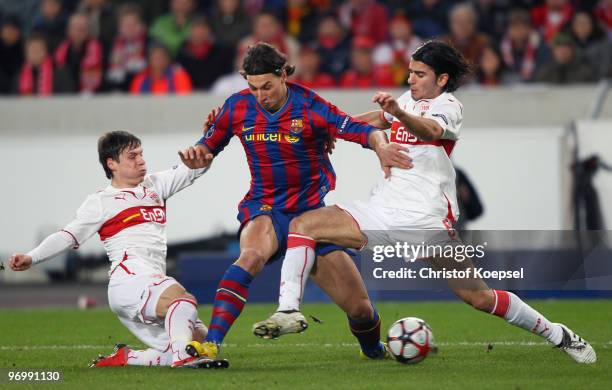 Christian Traesch of Stuttgart , Zlatan Ibrahimovic of Barcelona and Sami Khedira of Stuttgart battle for the ball during the UEFA Champions League...