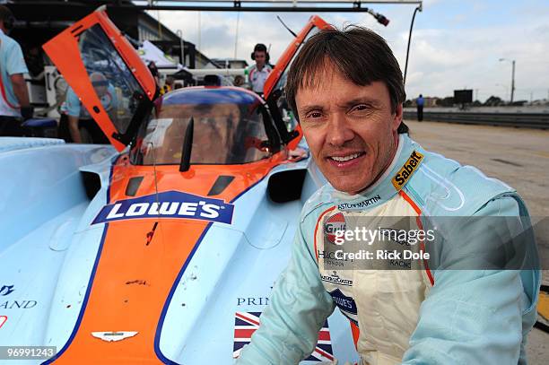 Adrian Fernandez of Mexico sitting along side the Aston Martin Racing Lola prototype, during the American Le Mans Series Winter Test at Sebring...