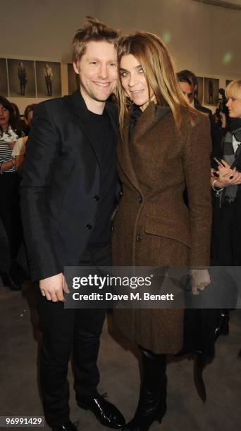 Burberry chief creative officer, Christopher Bailey and Carine Roitfeld the Editor-in-Chief of the French edition of Vogue pose backstage during the...