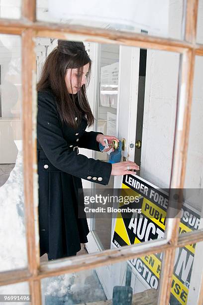 Realtor Sarah Carmona of Sellstate Dreams Realty enters a foreclosed home for inspection in Reno, Nevada, U.S., on Monday, Feb. 22, 2010. A record...