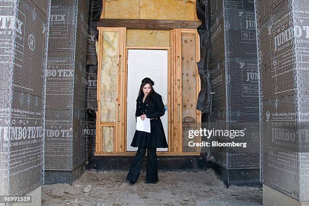 Realtor Sarah Carmona of Sellstate Dreams Realty inspects an incomplete foreclosed home in Reno, Nevada, U.S., on Monday, Feb. 22, 2010. A record...