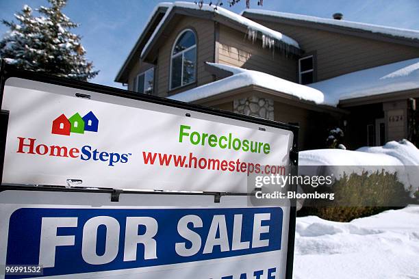 Foreclosure sign sits outside a home for sale in Reno, Nevada, U.S., on Monday, Feb. 22, 2010. A record number of Americans were in danger of losing...