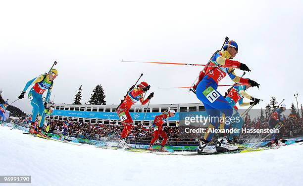 Competitors flood across the start line during the women's biathlon 4 x 6km relay on day 12 of the 2010 Vancouver Winter Olympics at Whistler Olympic...
