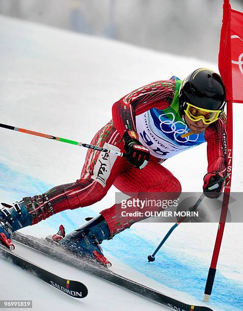 Morocco's Samir Azzimani clears a gate during the Men's Vancouver 2010 Winter Olympics Giant slalom event at Whistler Creek side Alpine skiing venue...