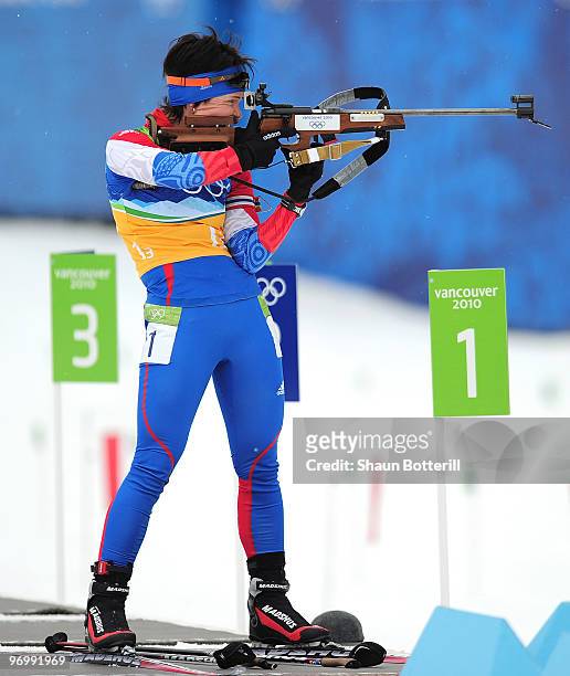 Svetlana Sleptsova of Russia shoots during the women's biathlon 4 x 6km relay on day 12 of the 2010 Vancouver Winter Olympics at Whistler Olympic...