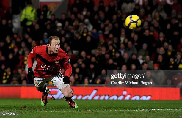 Wayne Rooney of Manchester United scores the first goal during the Barclays Premier League match between Manchester United and West Ham United at Old...