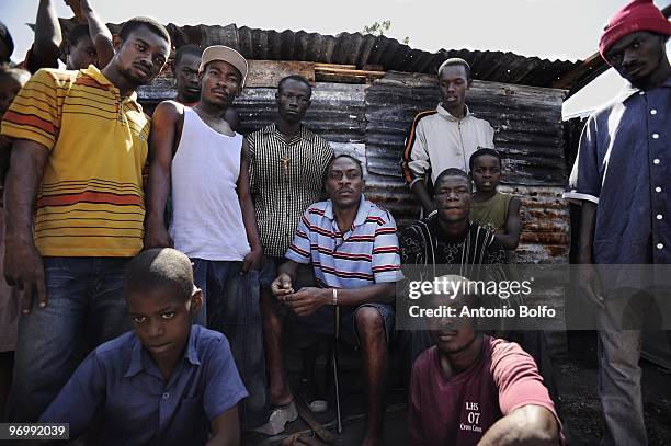 Local neighborhood gang leader helps to rebuild shelters for people who lost their homes in the earthquake, January 23, 2010 in Port au Prince,...