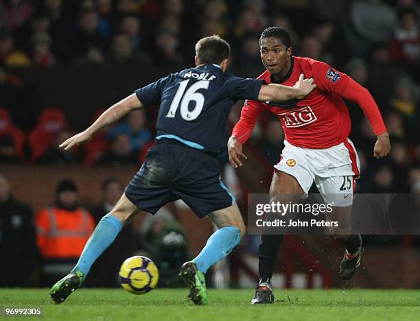 Antonio Valencia of Manchester United clashes with Mark Noble of West Ham United during the FA Barclays Premier League match between Manchester...