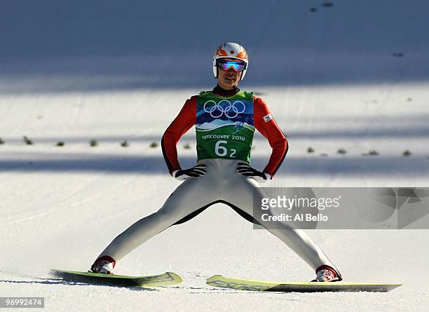 Taku Takeuchi of Japan competes in the men's ski jumping team event on day 11 of the 2010 Vancouver Winter Olympics at Whistler Olympic Park Ski...