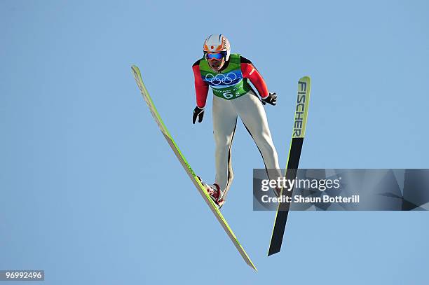 Taku Takeuchi of Japan competes in the men's ski jumping team event on day 11 of the 2010 Vancouver Winter Olympics at Whistler Olympic Park Ski...