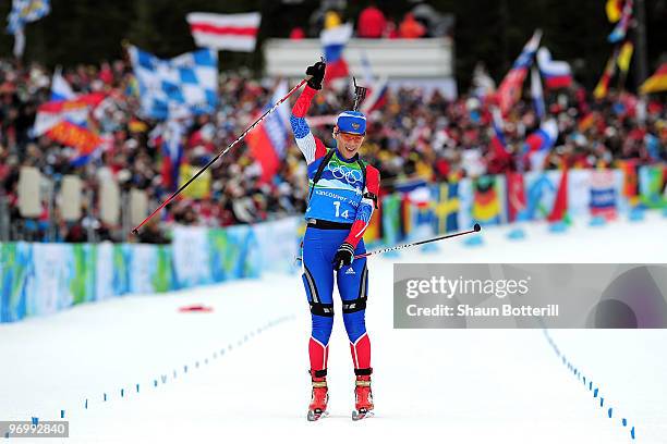 Olga Zaitseva of Russia cheers as she skies to the finish line to win the women's biathlon 4 x 6km relay on day 12 of the 2010 Vancouver Winter...