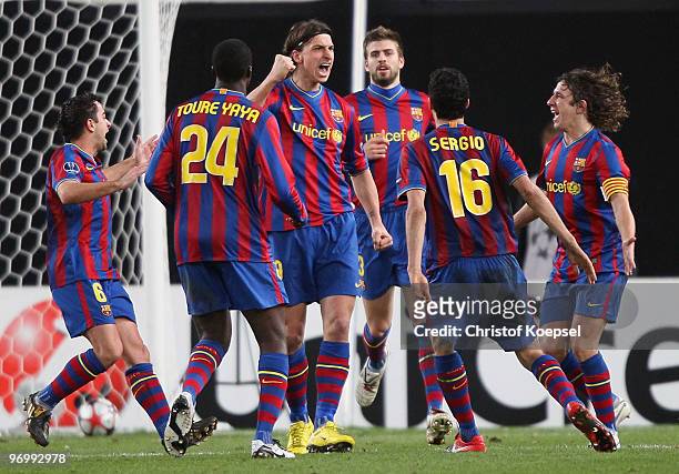 Zlatan Ibrahimovic of Barcelona celebrates scoring his team's first goal with team mates during the UEFA Champions League round of sixteen, first leg...