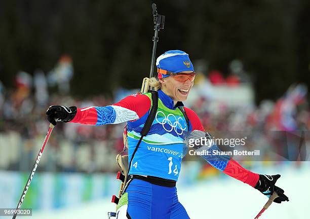 Olga Zaitseva of Russia cheers after crossing the finish line to win the women's biathlon 4 x 6km relay on day 12 of the 2010 Vancouver Winter...