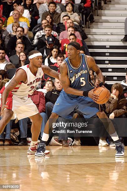 Josh Howard of the Washington Wizards handles the ball against Antoine Wright of the Toronto Raptors during the game on February 20, 2010 at Air...