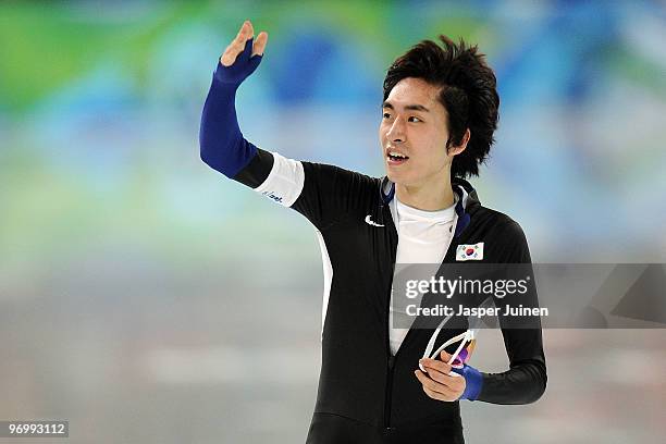 Lee Seung-Hoon of South Korea reacts after his skate in the men's speed skating 10000 m on day 12 of the 2010 Vancouver Winter Olympics at Richmond...