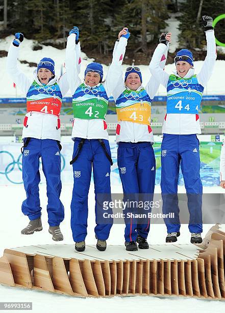 Marie Laure Brunet, Sylvie Becaert, Marie Dorin and Sandrine Bailly of France celebrate after winning the silver medal during the women's biathlon 4...