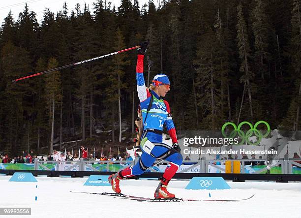 Olga Zaitseva of Russia celebrates as she approaches the finish line to win the women's biathlon 4 x 6km relay on day 12 of the 2010 Vancouver Winter...