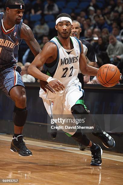 Corey Brewer of the Minnesota Timberwolves drives past Stephen Jackson of the Charlotte Bobcats during the game on February 10, 2010 at the Target...