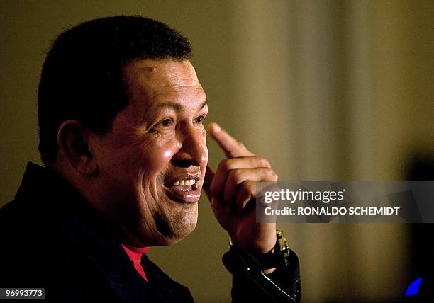 Venezuelan President Hugo Chavez speaks during a press conference after the closing of the Rio Group summit and the Caribbean Community meeting on...