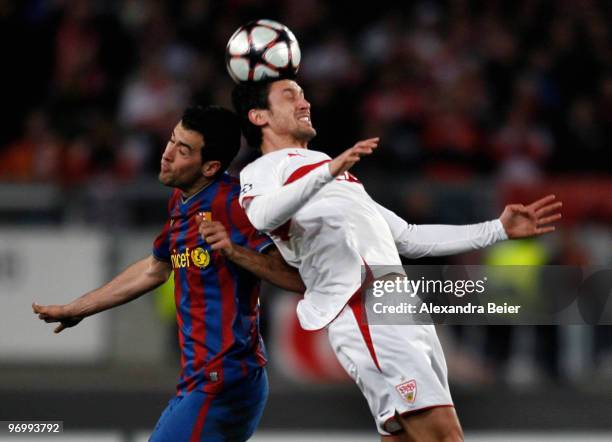 Roberto Hilbert of VfB Stuttgart heads for the ball with Sergio Busquets of FC Barcelona during the UEFA Champions League round of sixteen, first leg...