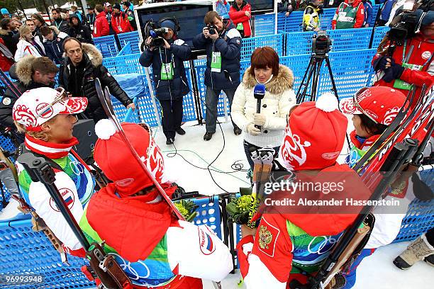 The Russian team of Svetlana Sleptsova, Olga Zaitseva, Olga Medvedtseva and Anna Bogaliy-Titovets of Russia are interviewed by the media after...