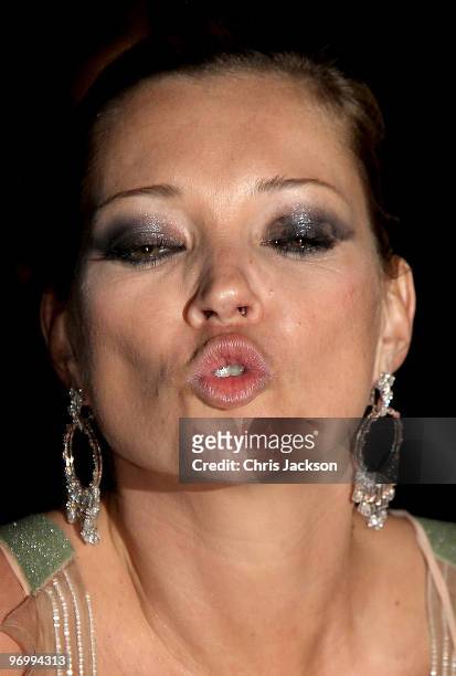 Kate Moss attends the Love Ball London at the Roundhouse on February 23, 2010 in London, England. The event is hosted by Russian model Natalia...