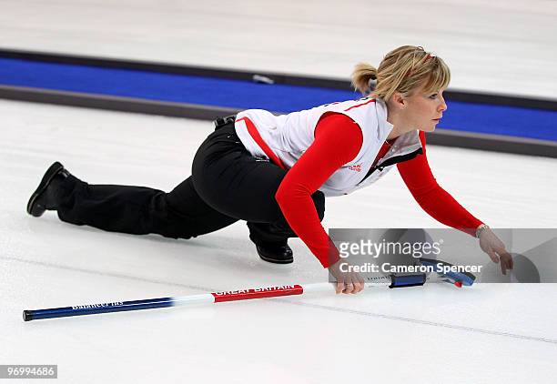 Kelly Wood of Great Britain watches her stone slide down the sheet during the women's curling round robin game between Canada and Great Britain on...