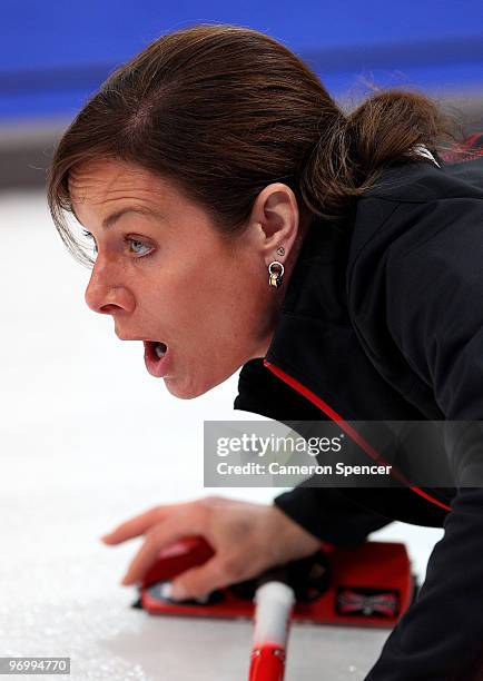 Canada skip Cheryl Bernard watches her stone slide down the sheet during the women's curling round robin game between Canada and Great Britain on day...