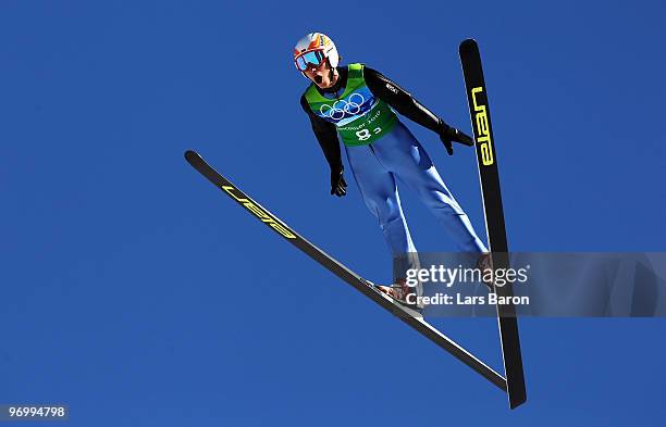 Lukasz Rutkowski of Poland competes in the men's ski jumping team event on day 11 of the 2010 Vancouver Winter Olympics at Whistler Olympic Park Ski...