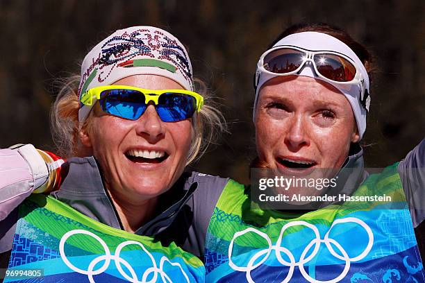 Claudia Nystad and Evi Sachenbacher-Stehle of Germany celebrate crossing winning the gold medal in the cross country skiing ladies team sprint final...