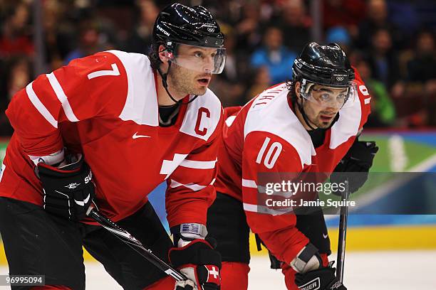 Mark Streit and Andres Ambuhl of Switzerland look on during the ice hockey Men's Qualification Playoff game between Switzerland and Belarus on day 12...