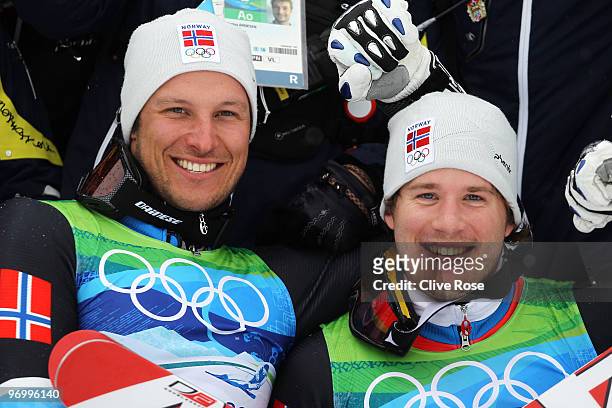 Bronze medalist Aksel Lund Svindal and silver medalist Kjetil Jansrud of Norway celebrate after their performance in the Alpine Skiing Men's Giant...