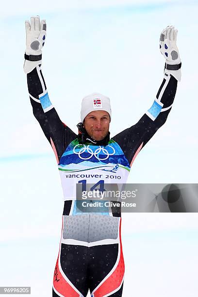 Bronze medalist Aksel Lund Svindal of Norway waves to the crowd during the flower ceremony for the Alpine Skiing Men's Giant Slalom on day 12 of the...