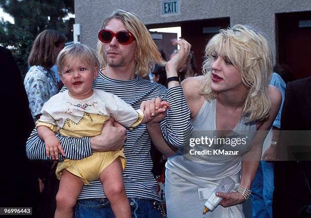 Kurt Cobain of Nirvana with wife Courtney Love and daughter Frances Bean Cobain