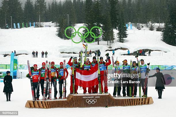 Team Austria celebrates their Olympic Gold, Team USA their Silver and Team Germany their Bronze in the Nordic Combined on day twelve of the 2010...