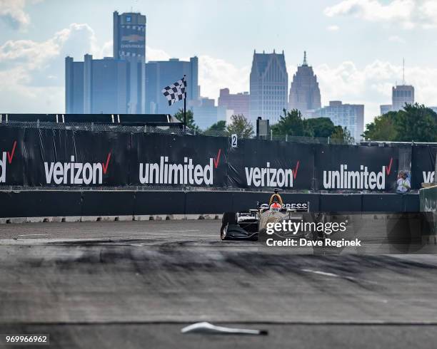 James Hinchcliffe of Canada drives the Honda Indy Car for Schmidt Peterson Motorsports with Vassier-Sullivan as a piece of car body lays on the track...