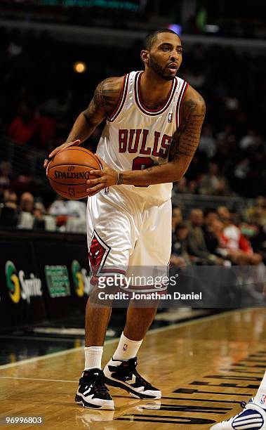 Acie Law of the Chicago Bulls looks to pass against the Philadelphia 76ers at the United Center on February 20, 2010 in Chicago, Illinois. The Bulls...