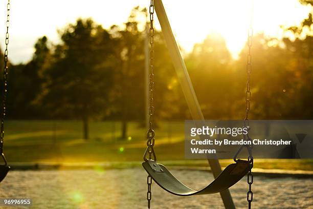 school bells ring again, lonely swings again - abandoned playground stock pictures, royalty-free photos & images